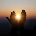 spiritual prayer hands sun shine with blurred beautiful sunset 1